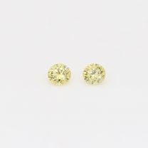 0.12 Total carat pair of round cut yellow diamonds