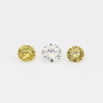 0.31 Total carat trio of round cut white and green diamonds