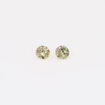 0.08 Total carat weight pair of round-cut fancy green diamonds