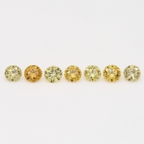 0.28 Total carat parcels of round cut orange and yellow diamonds